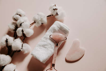 Jade face roller for beauty facial massage therapy with towel. Top viewの写真素材
