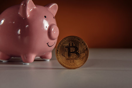 Golden Bitcoin with piggy bank. Cryptocurrency investment conceptの写真素材