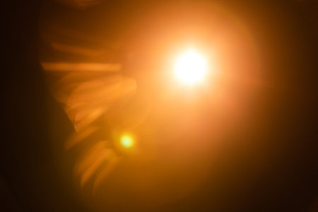 Solar lens flare on black backgroundの写真素材