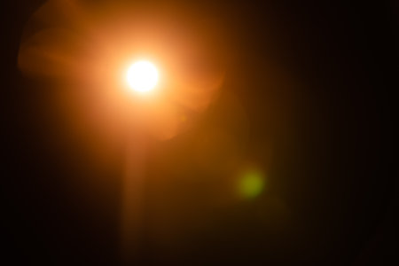 Abstract Natural Sun flare on the blackの写真素材