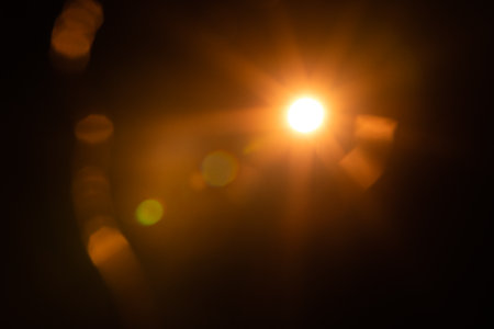 Solar lens flare on black backgroundの写真素材