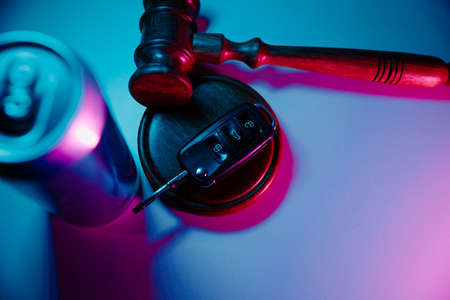 Car key, gavel and jar of beer. Dangerous drinking and drivingの写真素材