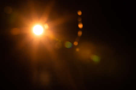 Abstract Natural Sun flare on the blackの写真素材