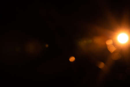 Abstract Natural Sun flare on the blackの写真素材