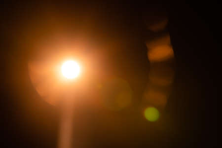 Abstract Natural Sun flare on the blackの写真素材