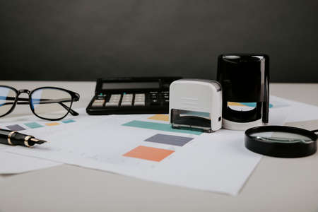 Concept of signing a contract or notary. Office desktop with documents and stampの写真素材