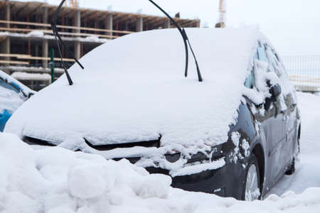 the cars on the parking under snowの写真素材