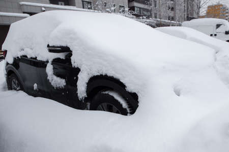 the cars on the parking under snowの写真素材