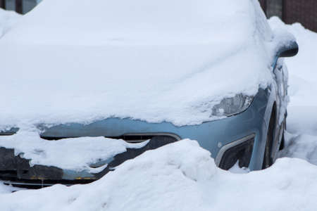 Cars under the snow. Snowfall in the cityの写真素材