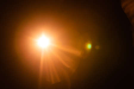 Abstract Natural Sun flare on the blackの写真素材