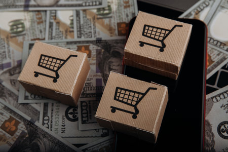 Product package boxes and smartphone close-up. Online shopping and delivery conceptの写真素材