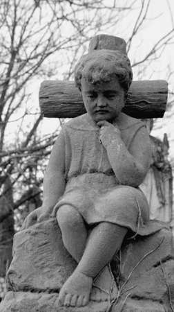 The statue of the boy on the cross.の写真素材