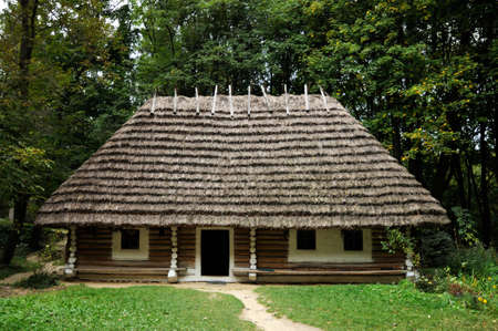 Old wooden hut covered with strawのeditorial素材
