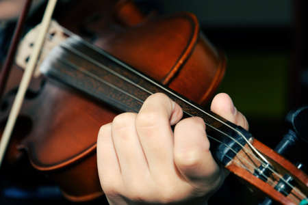 Symphony music, violinist at concert, hand close upの写真素材