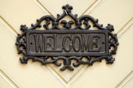 Sign on the door "welcome"の写真素材