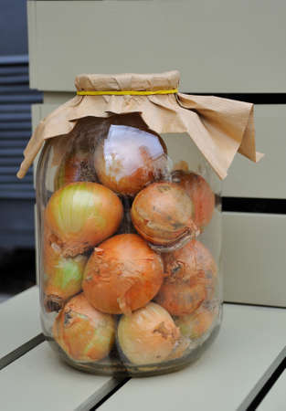 Onions in a glass jarの写真素材