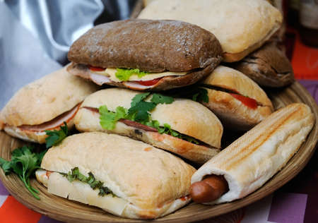 Popular Italian panini sandwich with ham on wooden backgroundの写真素材