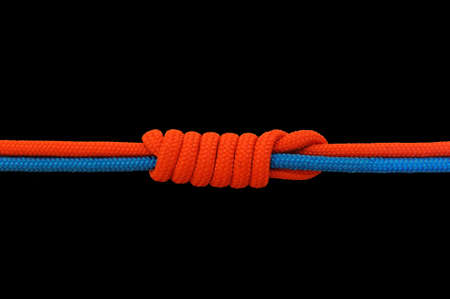 Knot on a cord on a dark backgroundの写真素材