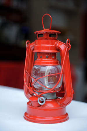 Red kerosene lamp on the tableの写真素材
