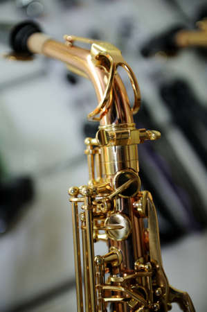 part of a saxophone close up on the background music storeの写真素材