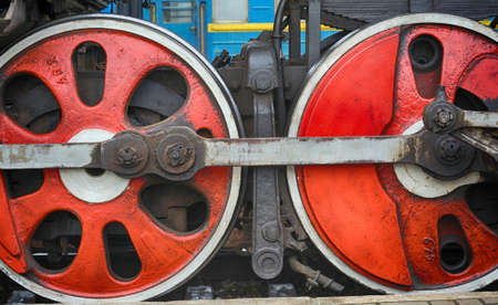 Train drive mechanism and red wheels of an old soviet steam locomotive