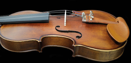 Detail of violin on dark background closeupの写真素材
