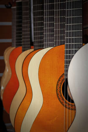 The image of guitars on a show-window of musical shopの写真素材