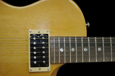 Electric guitar isolated on a black background