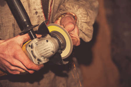 angle grinder in hand workingの写真素材