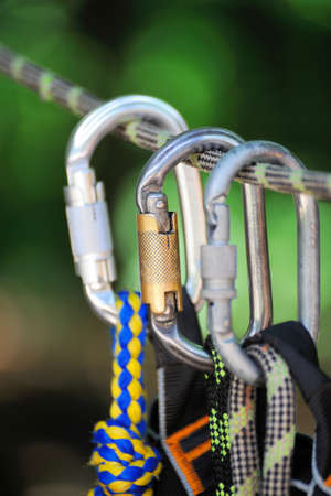 Climbing sports image of a carabiner on a rope in a forestの写真素材