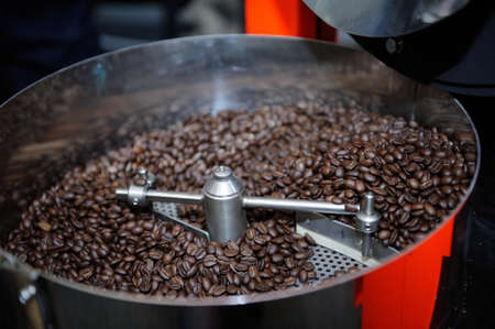 Freshly roasted coffee beans in a coffee roaster