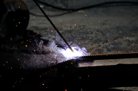 Sparks from welding on a dark background.
