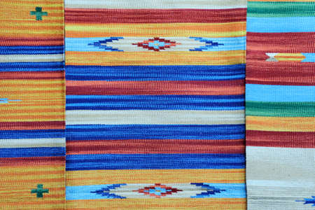 Rolls of colorful fabric as a vibrant background imageの写真素材