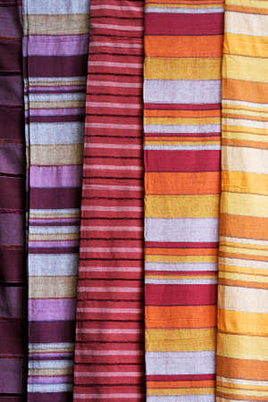 Rolls of colorful fabric as a vibrant background image