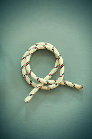 Knot on a cord ( retro style photo ) .