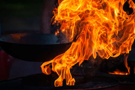 Cooking street food on a hot frying pan. Street food festivalの写真素材