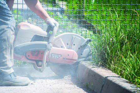 The joint cutter machine on a brushed concrete surface. Construction equipment for cutting saw slab.