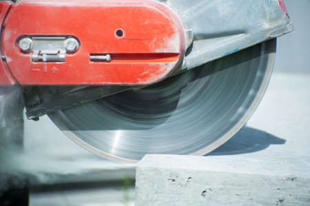 The joint cutter machine on a brushed concrete surface. Construction equipment for cutting saw slab.の写真素材