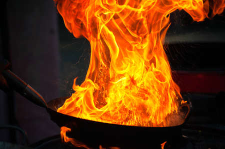 Cooking street food on a hot frying pan. Street food festivalの写真素材