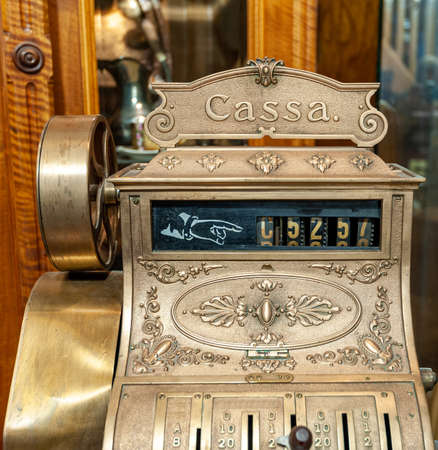 Close-up of the front of an old-time antique cash register.