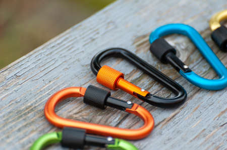 Metal carabine for mountaineering. Photo of colored carabines. Climbing concept