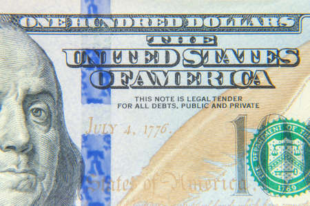 Closeup banknotes hundred dollar bills. 100 dollars banknote closeup macro fragment.の写真素材
