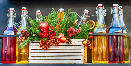 Street decoration with bottles and Christmas tree branches. Winter compositionの写真素材