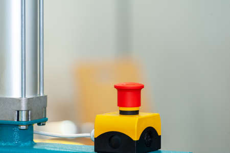 The red emergency button or stop button for Hand press. STOP Button for industrial machine,...