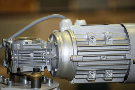 Powerful electric motor with reducer. Electric motor on machineの写真素材