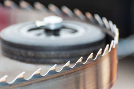 Band saw blade close up macro shot. Saw close-up, closeup, industrial background.の写真素材