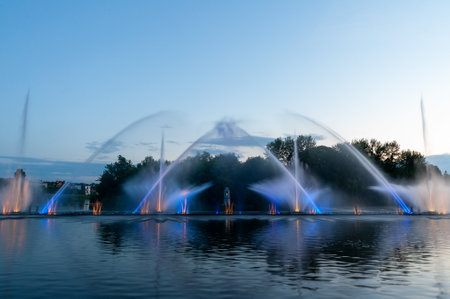 Musical fountain with laser animations. Night laser fountain show, on the Roshen embankment, the Ukrainian city of Vinnitsa.の写真素材