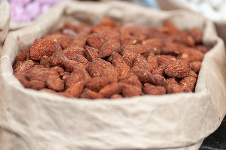 Assorted nuts in paper boxes for sale in the market. Selective focus.の写真素材