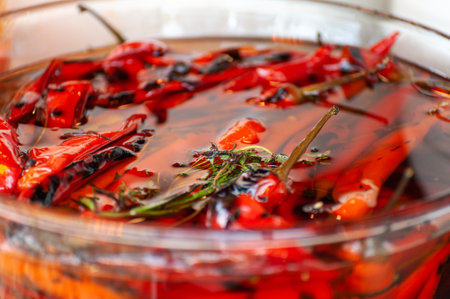 red pickled peppers close up at a street food festivalの写真素材