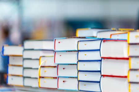 Stack of new books on the table. Books on the forum of manufacturers of printed products.の写真素材